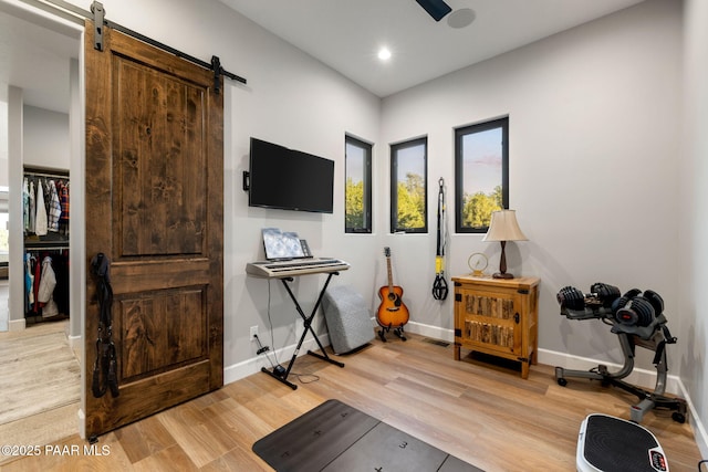 15425 N Talking Rock Ranch Rd, Prescott, AZ 86305 - workout room with light wood-style floors, a barn door, and recessed lighting