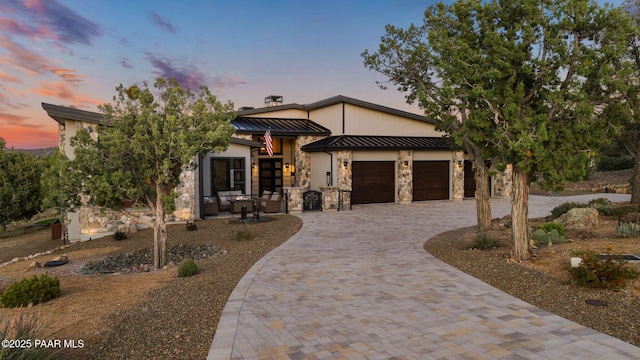15425 N Talking Rock Ranch Rd, Prescott, AZ 86305 - contemporary home with a standing seam roof, decorative driveway, an attached garage, a metal roof, and stone siding