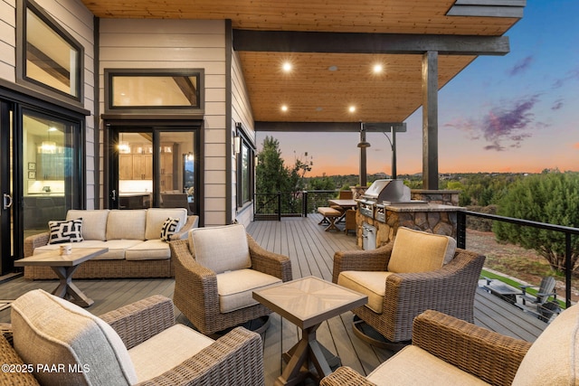 15425 N Talking Rock Ranch Rd, Prescott, AZ 86305 - deck at dusk featuring outdoor lounge area and an outdoor kitchen
