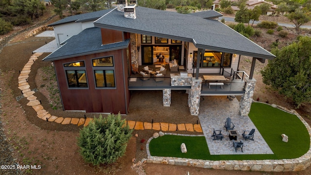 15425 N Talking Rock Ranch Rd, Prescott, AZ 86305 - back of house with a balcony, a patio, roof with shingles, a chimney, and a lawn
