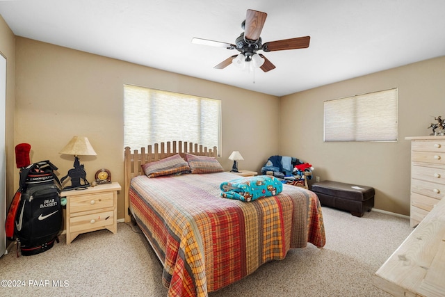 carpeted bedroom featuring ceiling fan