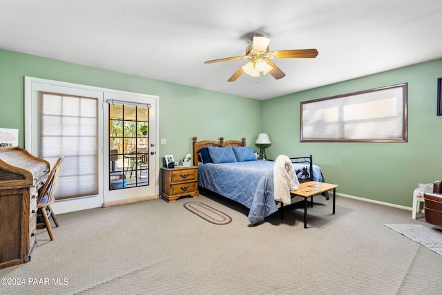 carpeted bedroom with access to exterior and ceiling fan