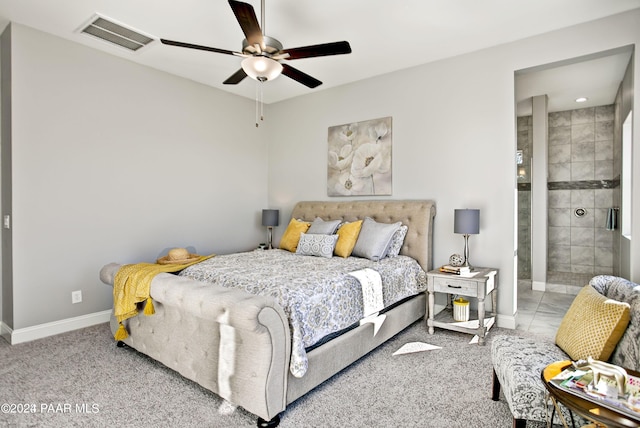 bedroom with visible vents, baseboards, ensuite bathroom, a ceiling fan, and carpet