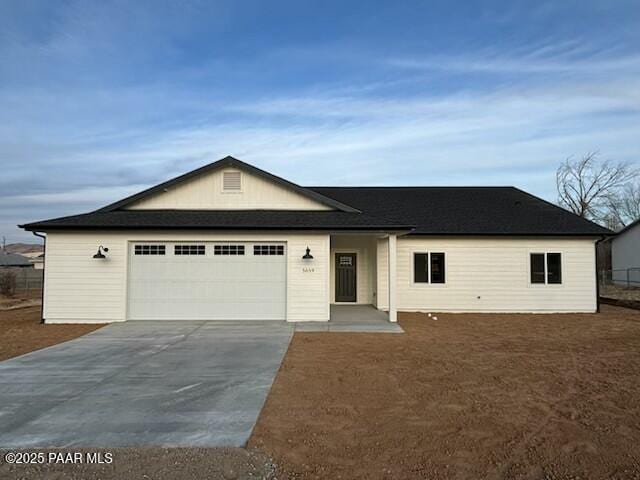 ranch-style home featuring a garage