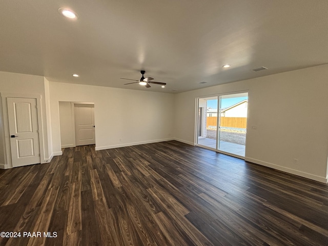 spare room with dark hardwood / wood-style floors and ceiling fan