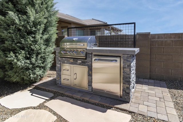 5220 Peavine View Trl, Prescott, AZ 86301 - view of patio featuring exterior kitchen, grilling area, and fence