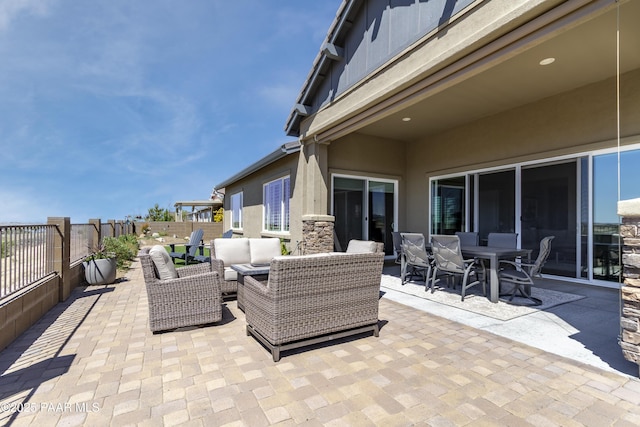 5220 Peavine View Trl, Prescott, AZ 86301 - view of patio with outdoor dining area, a fenced backyard, and an outdoor hangout area