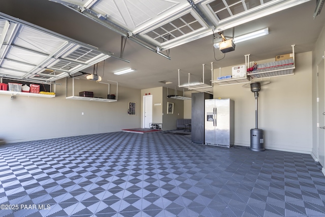 5220 Peavine View Trl, Prescott, AZ 86301 - garage featuring stainless steel fridge and a garage door opener