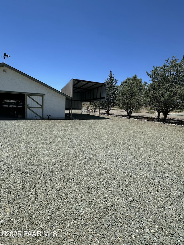 13502 S Burton Rd, Mayer, AZ 86333 - view of yard with a pole building, an outdoor structure, and a carport