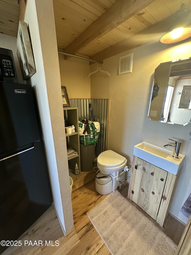 13502 S Burton Rd, Mayer, AZ 86333 - full bath featuring wood finished floors, vanity, a wood ceiling with exposed beams, and a shower