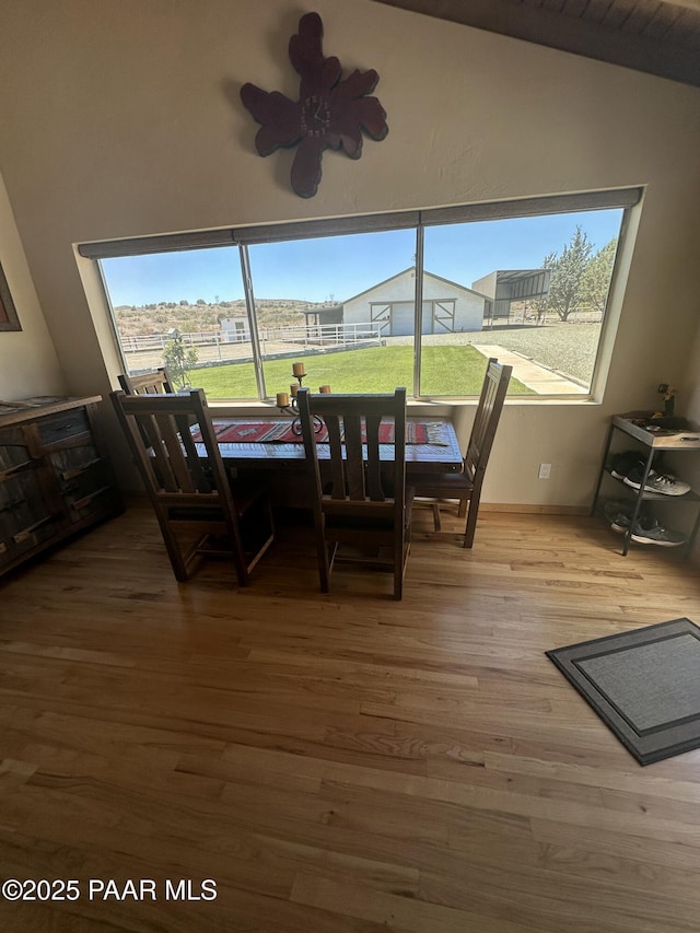 13502 S Burton Rd, Mayer, AZ 86333 - dining area featuring wood finished floors and vaulted ceiling