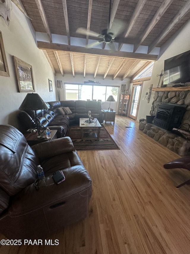 13502 S Burton Rd, Mayer, AZ 86333 - living room with wood finished floors, a ceiling fan, healthy amount of natural light, wooden ceiling, and a stone fireplace
