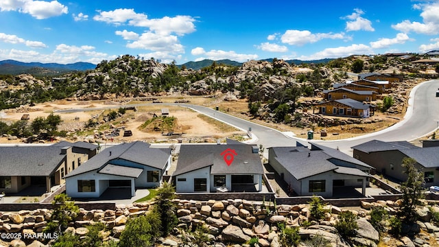 birds eye view of property with a mountain view and a residential view