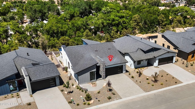 birds eye view of property with a residential view