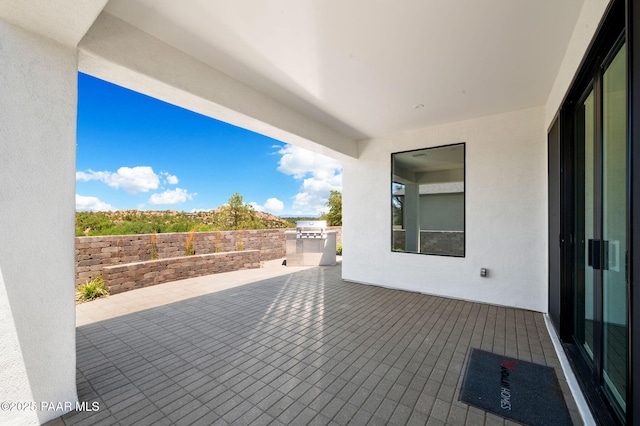 view of patio featuring grilling area and an outdoor kitchen