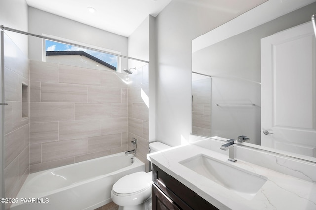 bathroom with toilet, shower / bathing tub combination, and vanity