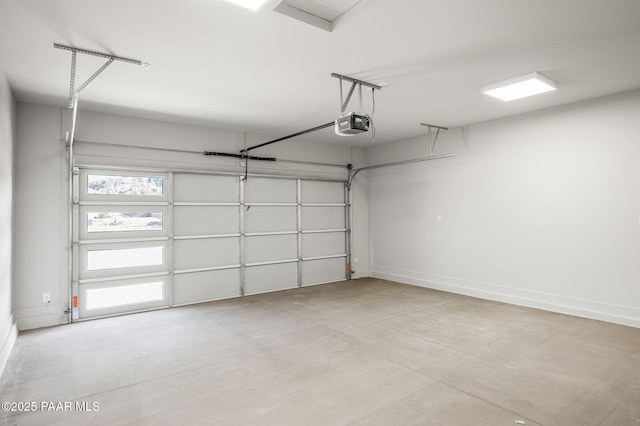 garage featuring baseboards and a garage door opener