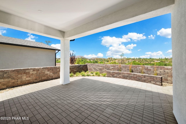 view of patio / terrace featuring a mountain view