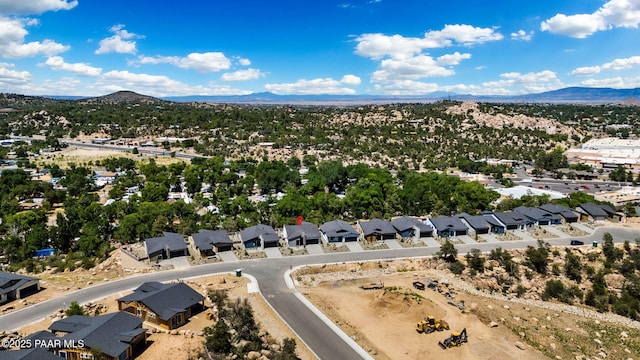 drone / aerial view featuring a mountain view and a residential view