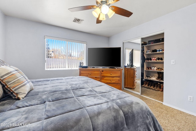 bedroom with ceiling fan, carpet, a closet, visible vents, and baseboards