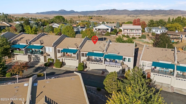 birds eye view of property with a mountain view