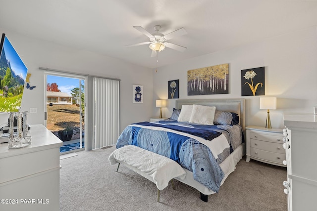 carpeted bedroom with ceiling fan and access to exterior