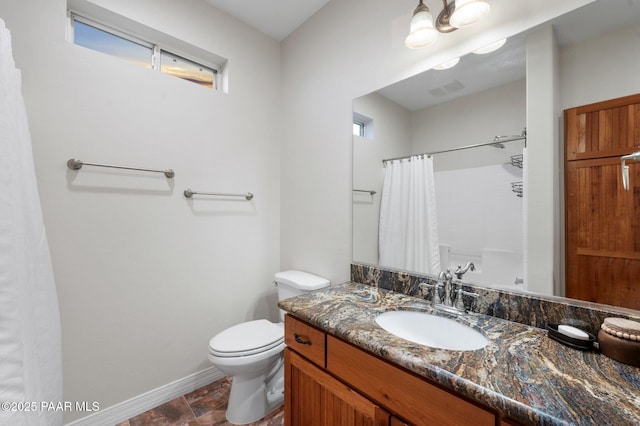 16025 N Hereford Rd, Chino Valley, AZ 86323 - full bath with vanity, baseboards, toilet, and stone finish floors
