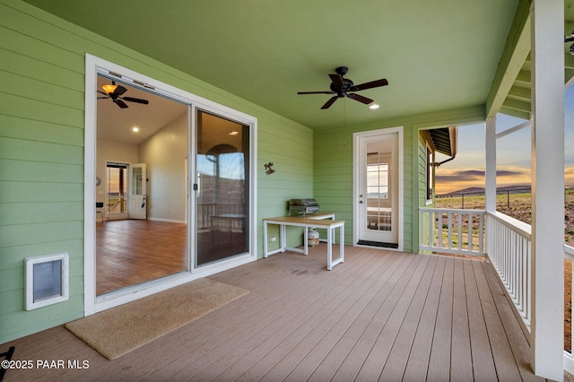 16025 N Hereford Rd, Chino Valley, AZ 86323 - deck at dusk featuring ceiling fan