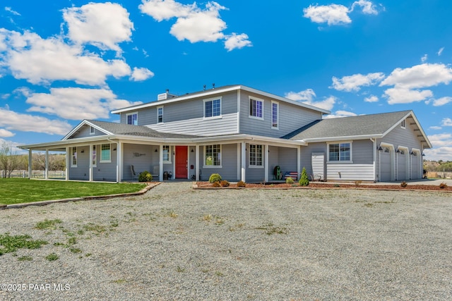 farmhouse-style home featuring fence, a chimney, an attached garage, driveway, and a porch