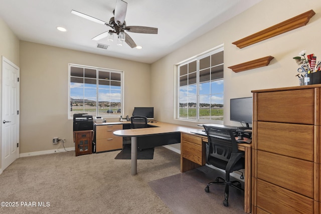 office space with ceiling fan, visible vents, baseboards, light carpet, and recessed lighting