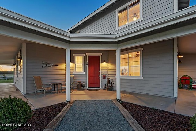 doorway to property with covered porch