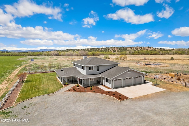 bird's eye view featuring a rural view and a mountain view