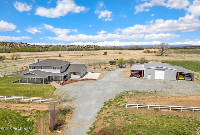 bird's eye view with a mountain view and a rural view