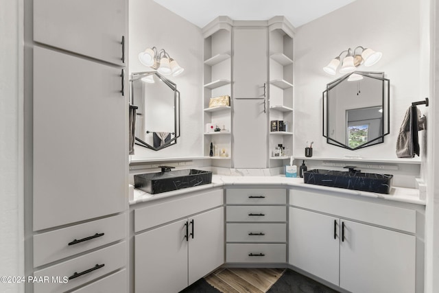 bathroom featuring vanity and wood-type flooring