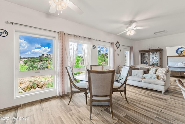 dining area featuring ceiling fan and light hardwood / wood-style floors