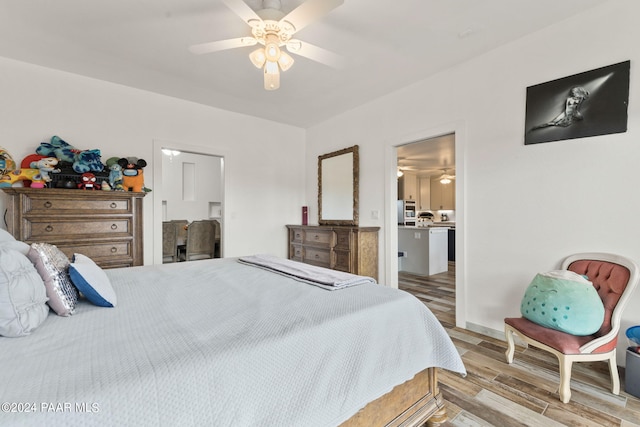 bedroom featuring ceiling fan and light hardwood / wood-style floors