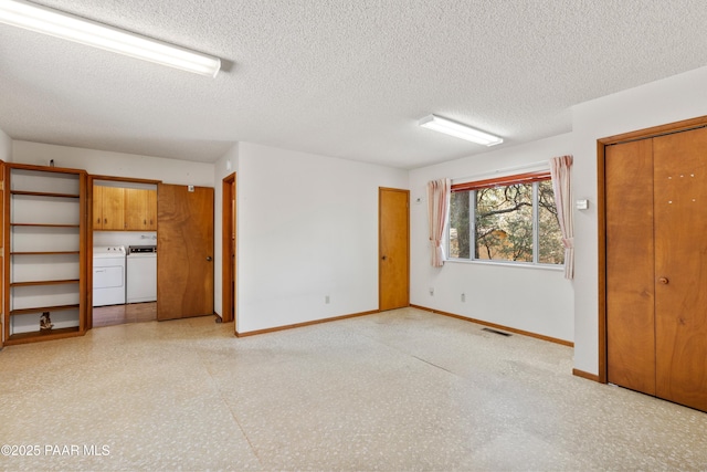 3040 Hozoni Rd, Prescott, AZ 86305 - unfurnished living room with independent washer and dryer, a textured ceiling, baseboards, and visible vents