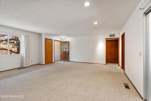 3040 Hozoni Rd, Prescott, AZ 86305 - carpeted empty room with visible vents, a textured ceiling, and recessed lighting