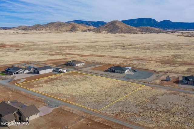 birds eye view of property featuring a mountain view