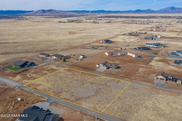 drone / aerial view with a desert view and a mountain view