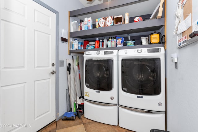 washroom featuring washer and dryer and laundry area