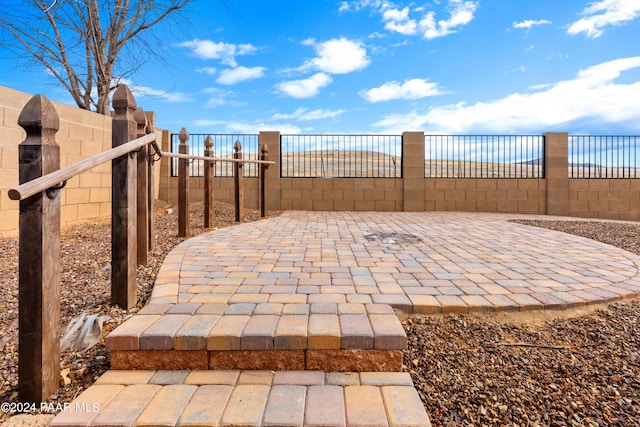 view of patio / terrace featuring fence