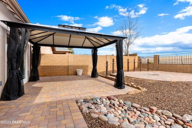 view of patio / terrace featuring a gazebo and fence