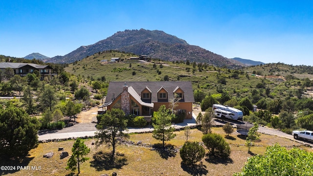 birds eye view of property featuring a mountain view