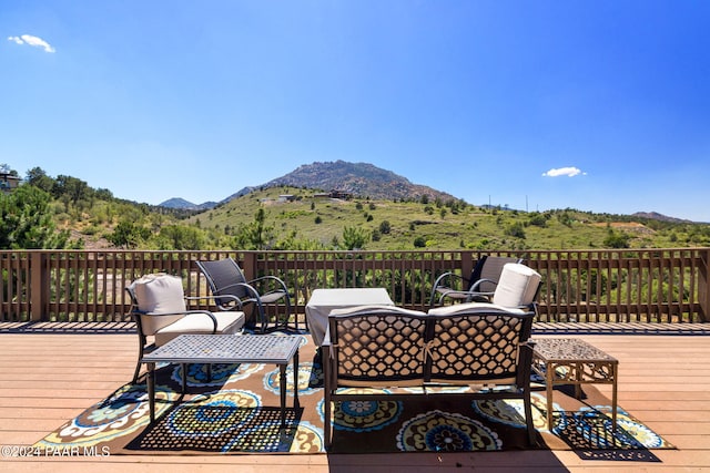 wooden terrace featuring a mountain view