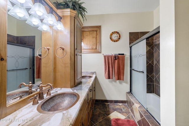 bathroom featuring vanity and enclosed tub / shower combo