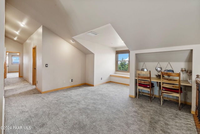 office area featuring carpet and vaulted ceiling