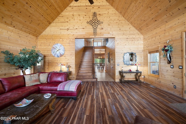 living room with hardwood / wood-style flooring, high vaulted ceiling, wooden walls, and wood ceiling