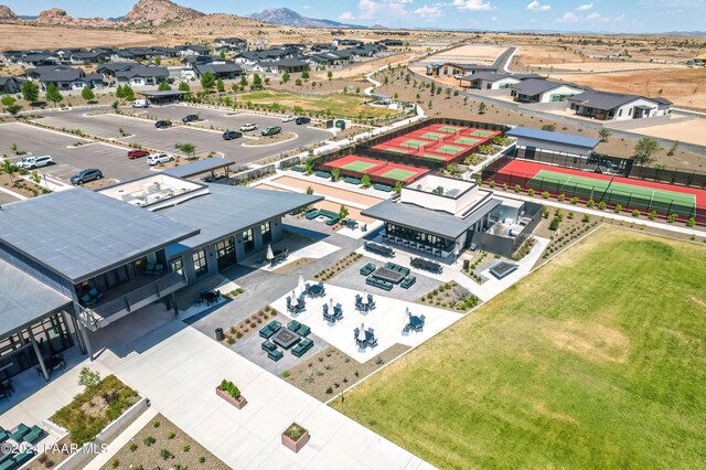 birds eye view of property with a mountain view