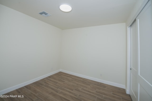 unfurnished room featuring hardwood / wood-style floors